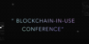 Worte "Blockchain in use Conference" auf schwarzem Untergrund