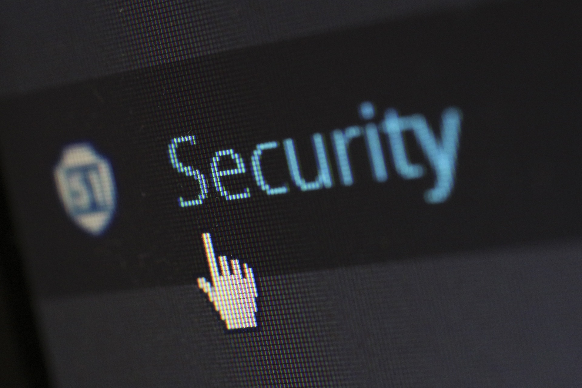 Cursor in Gestalt eine ausgestreckten Zeigefingers zeigt auf einen Button mit dem Schriftzug "Security".auf